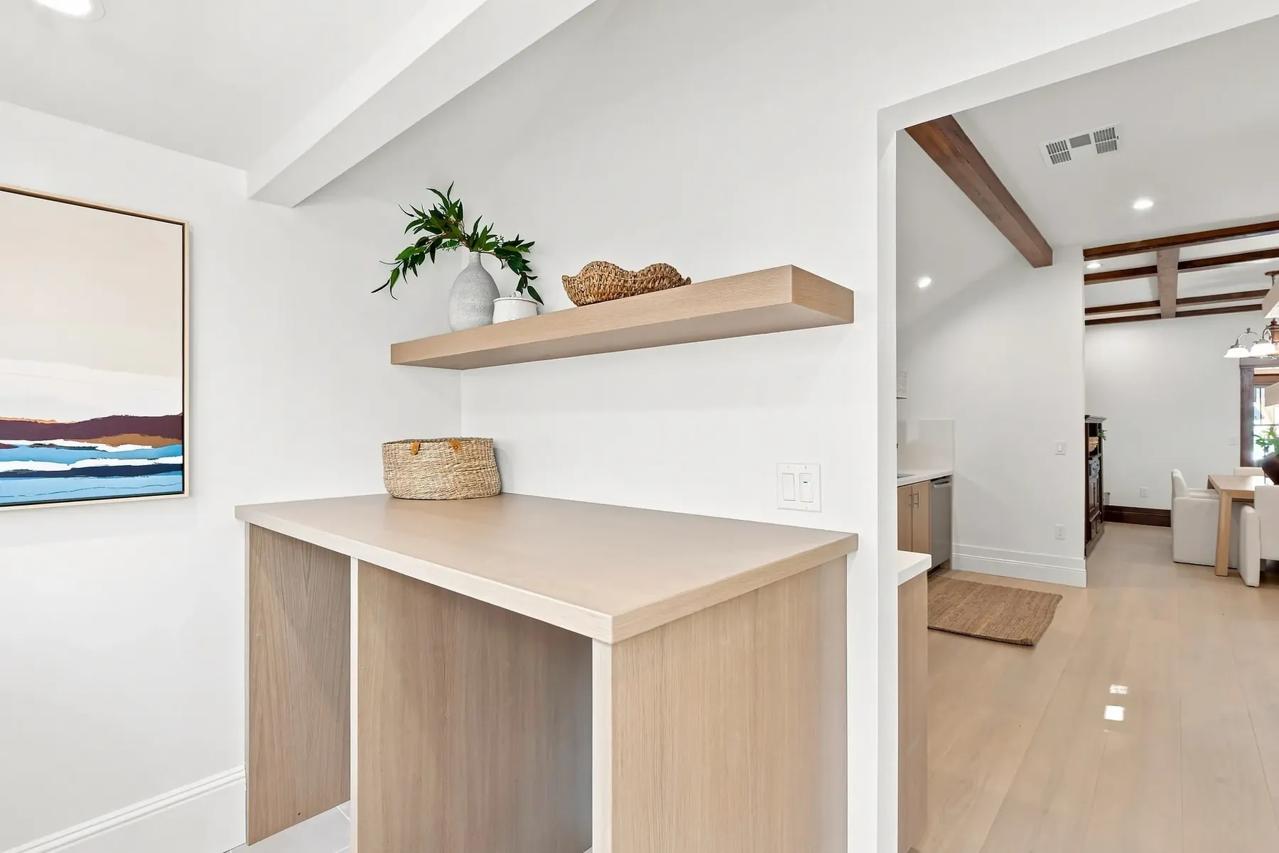 New built-in counter and open shelf, detailed to match the kitchen's white oak.