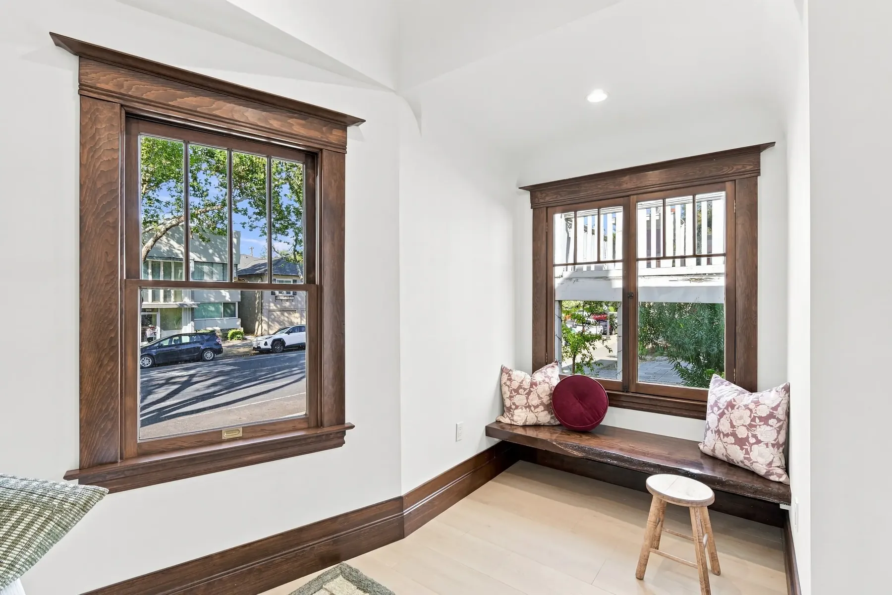 Window seat in the original wide trim. The seat was rebuilt; the casing around it is the house's own.